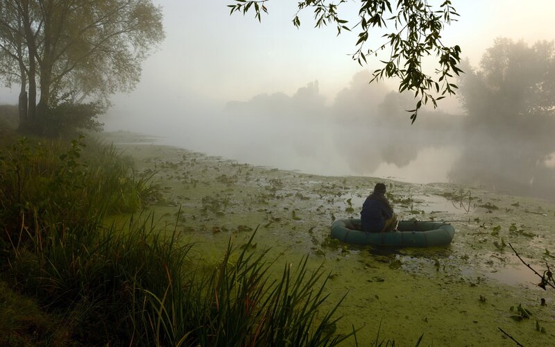 Fishing in a misty morning