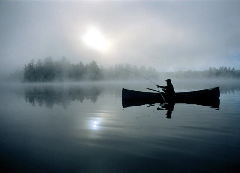 Fishing in the misty morning
