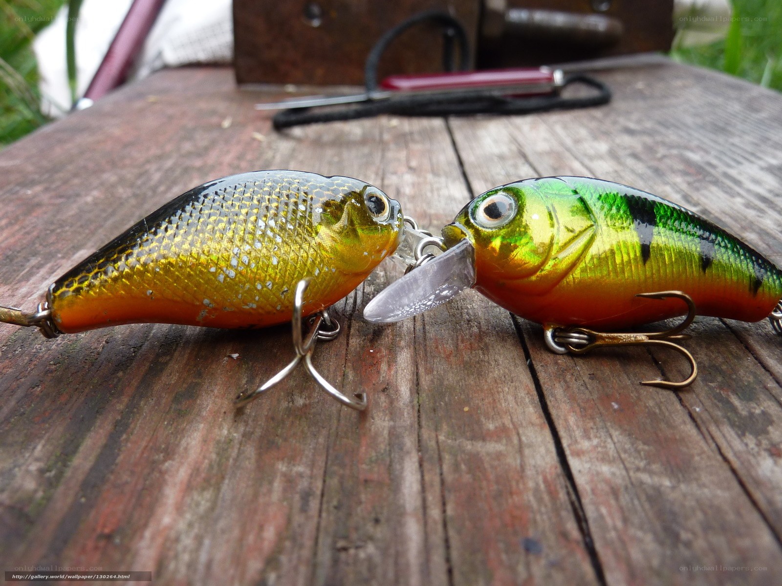 fishing lures on wooden table