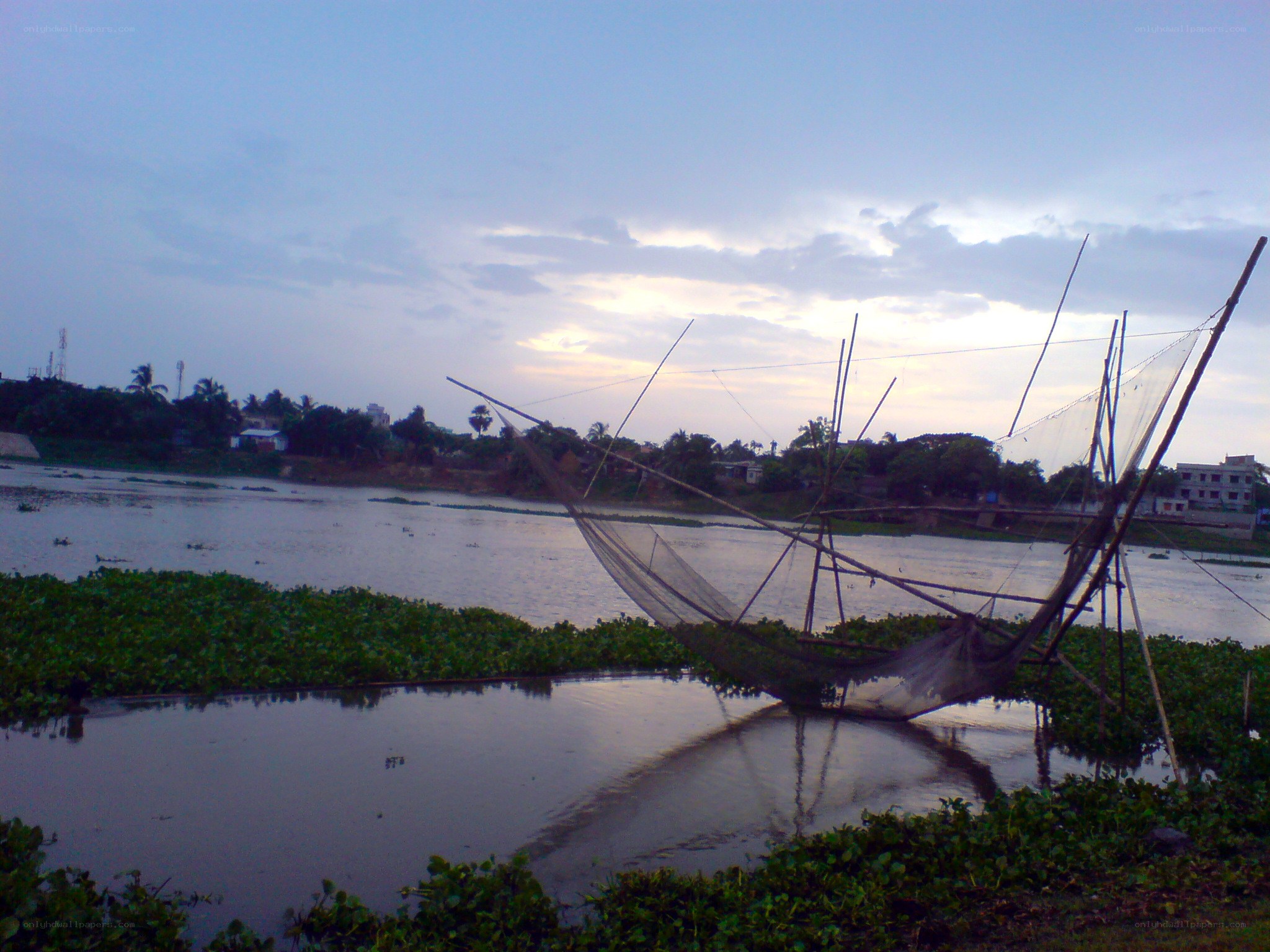 Fishing net on a river at dusk