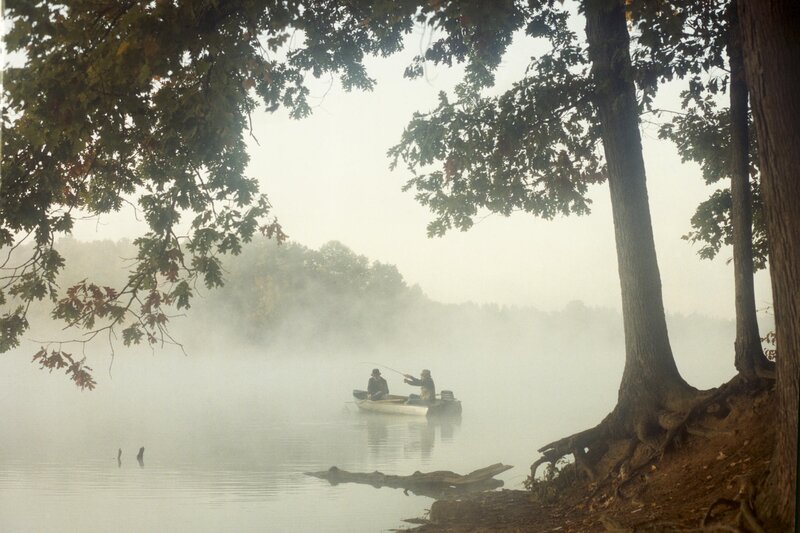 Fishing on a misty lake
