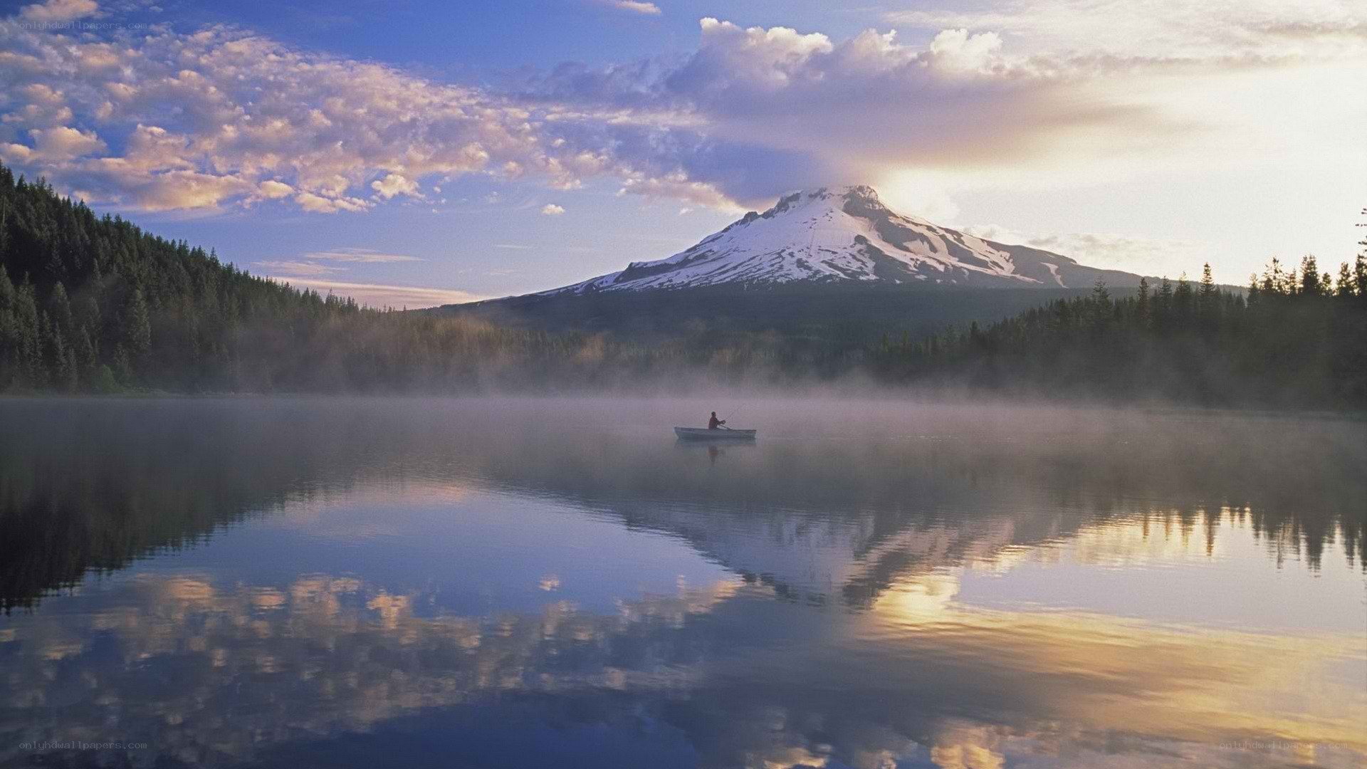 Fishing on a misty lake