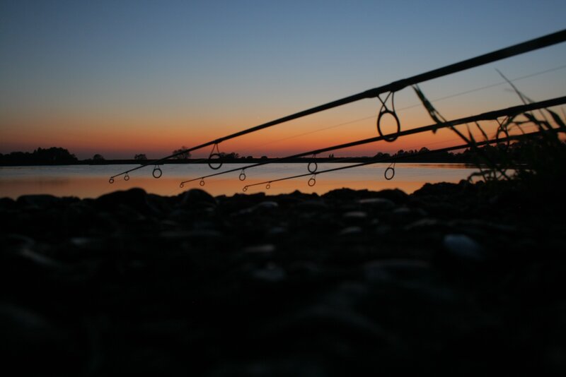 Fishing rods at sunset