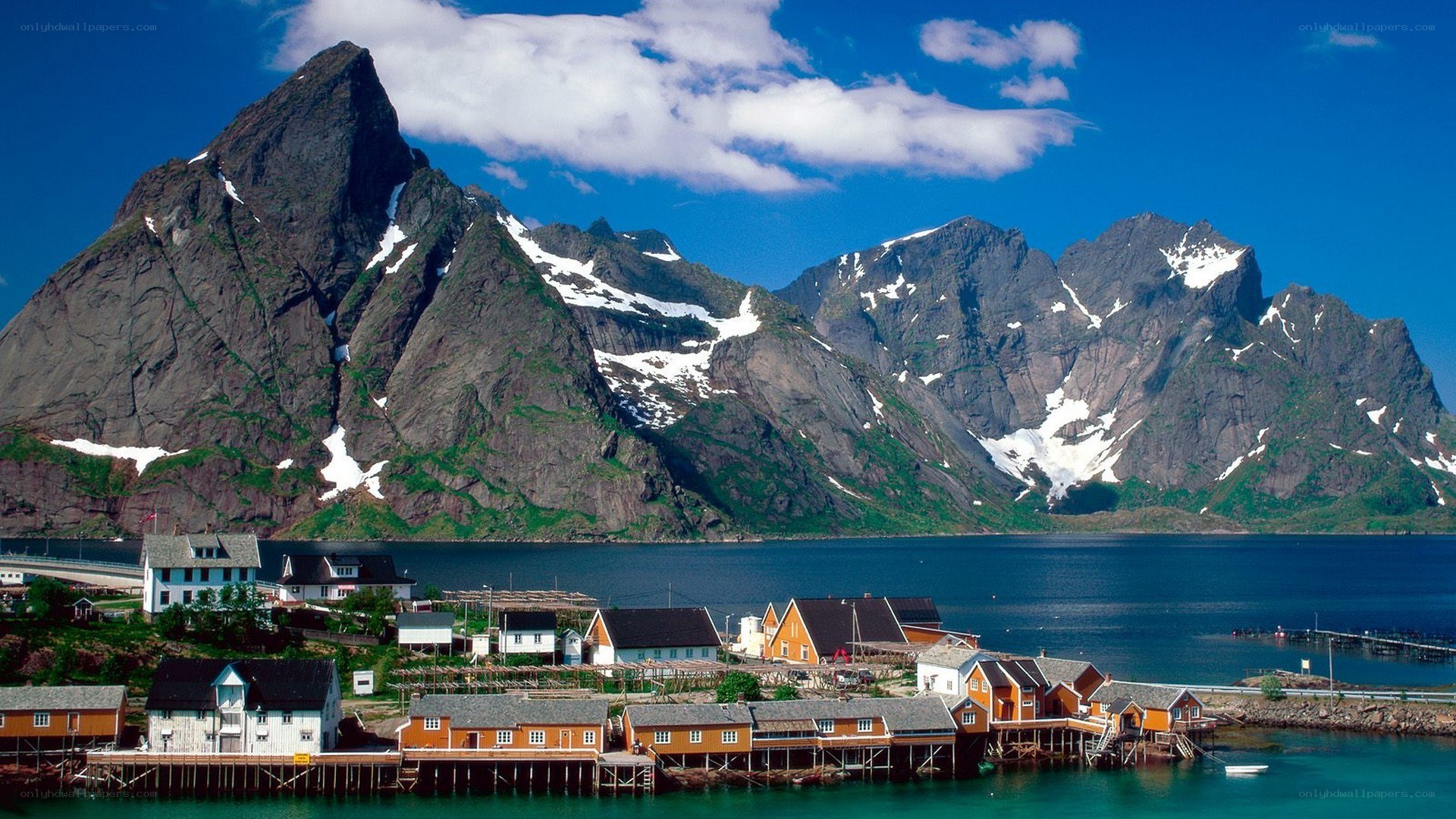 Fishing village by mountains