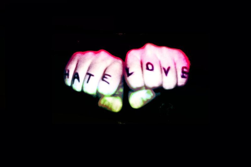 fists with hate and love text
