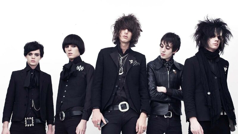 Five Band Members in Black — Serious