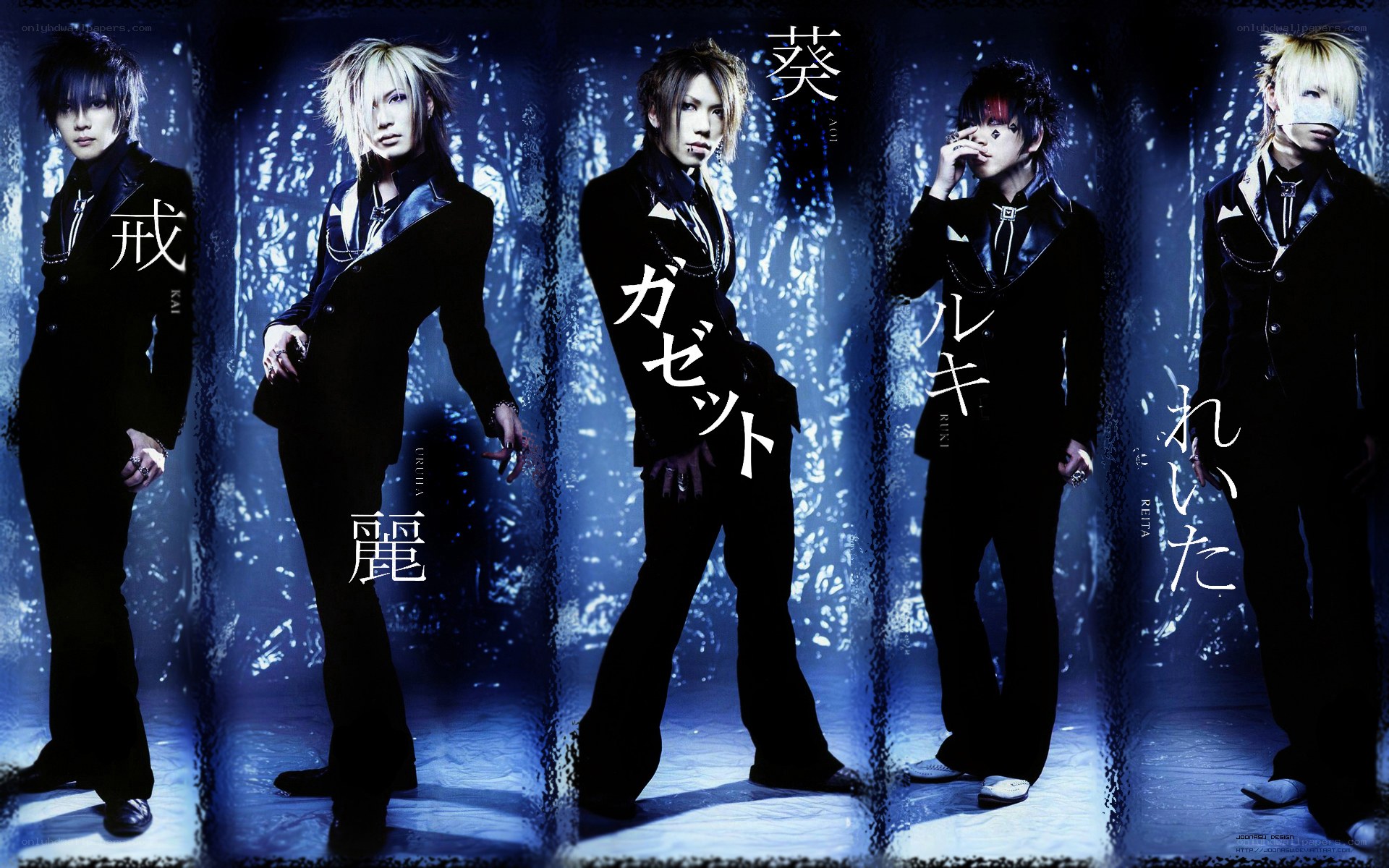 five band members in black suits