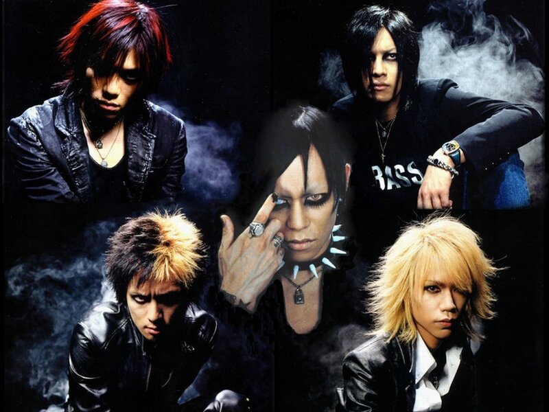 Five Band Members in Dark Clothing — Black, Dramatic