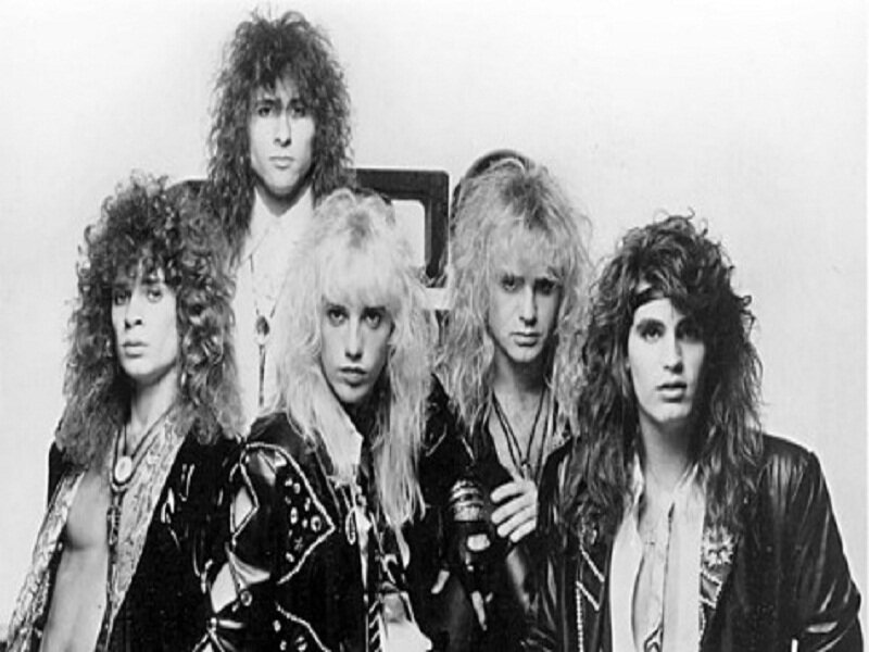 Five Band Members Posing — Black, Serious