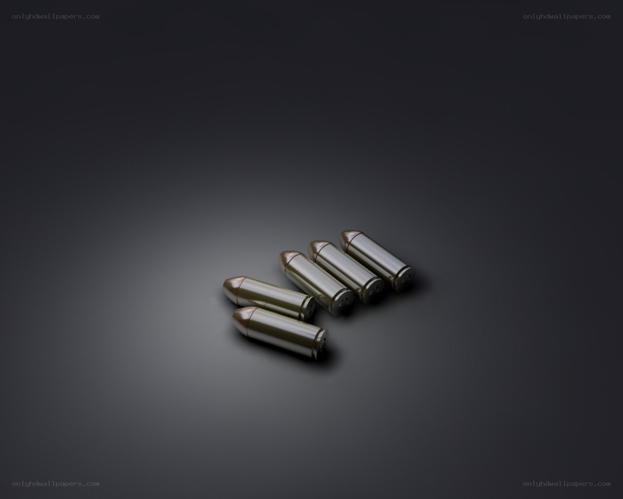 Five bullets on dark surface