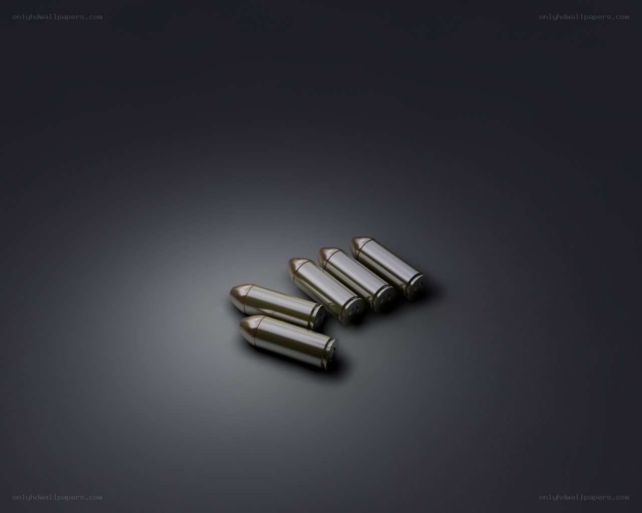 Five bullets on dark surface