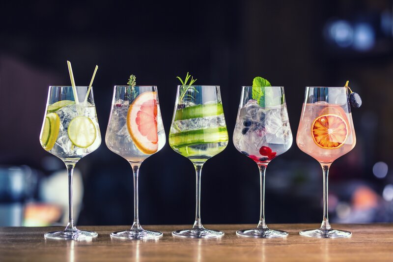 Five Cocktails in Glasses — Clear