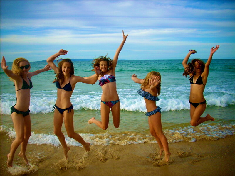 Five Girls Jumping on Beach