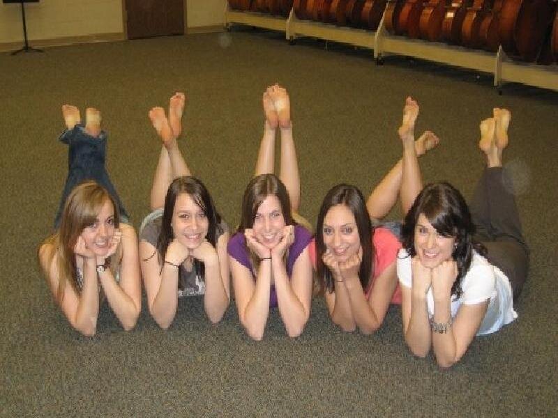 five girls lying on the floor