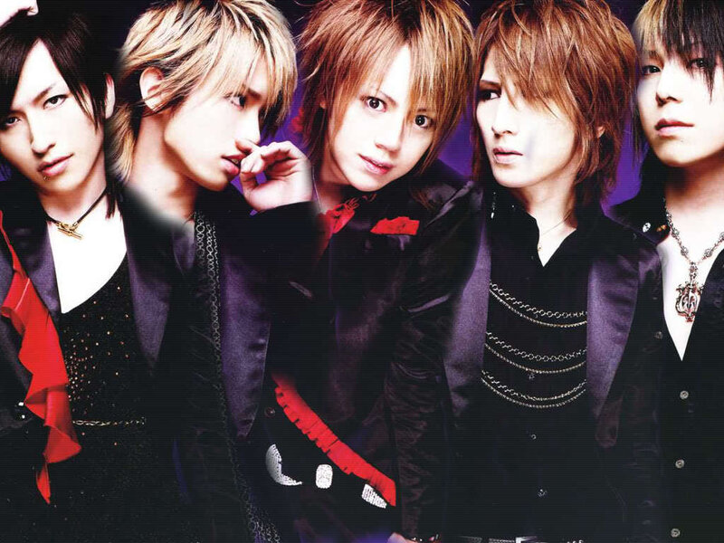 five male band members in black