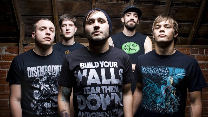 Five Men in Band Shirts — Black, Serious