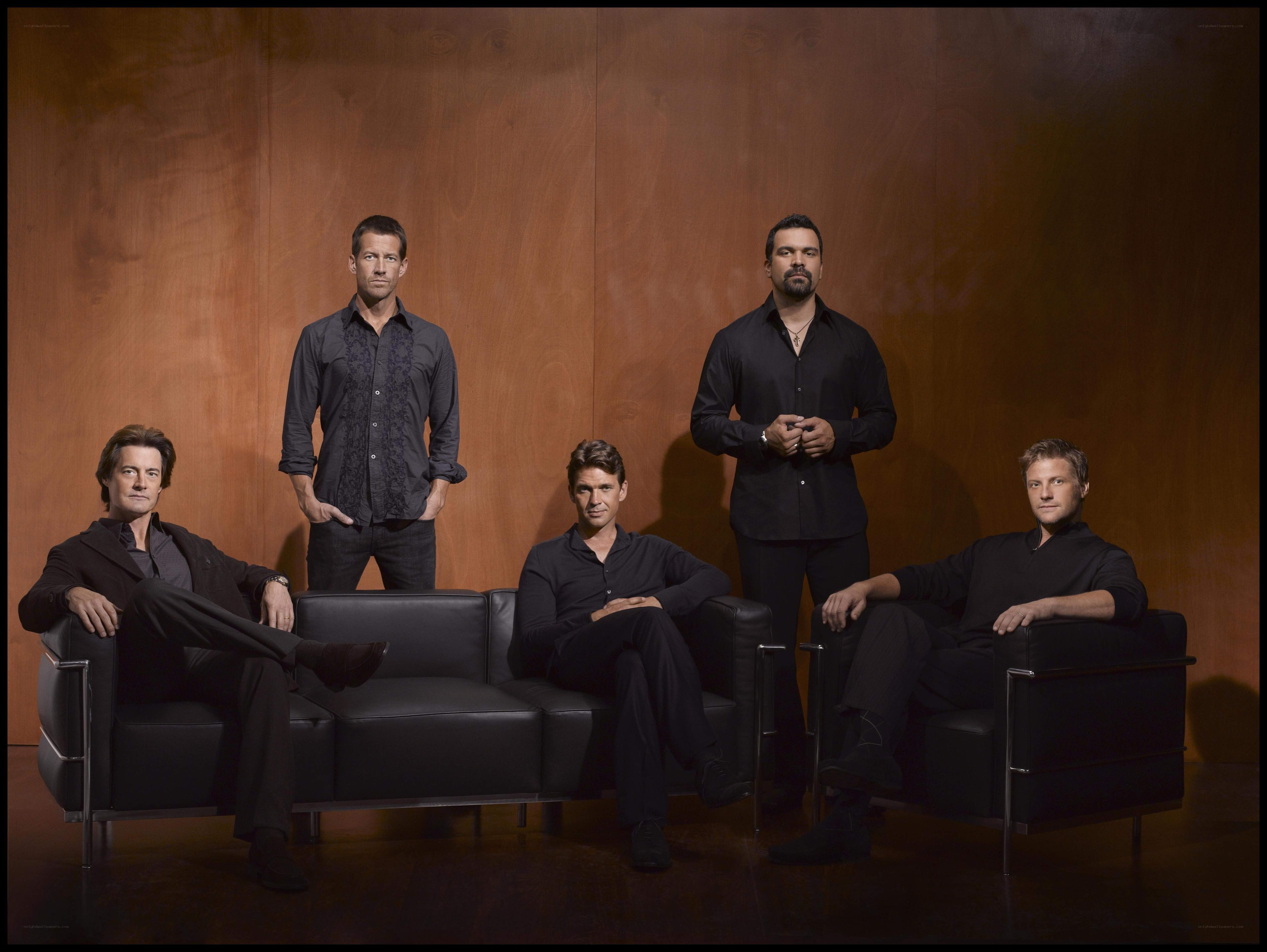 five men in black clothing