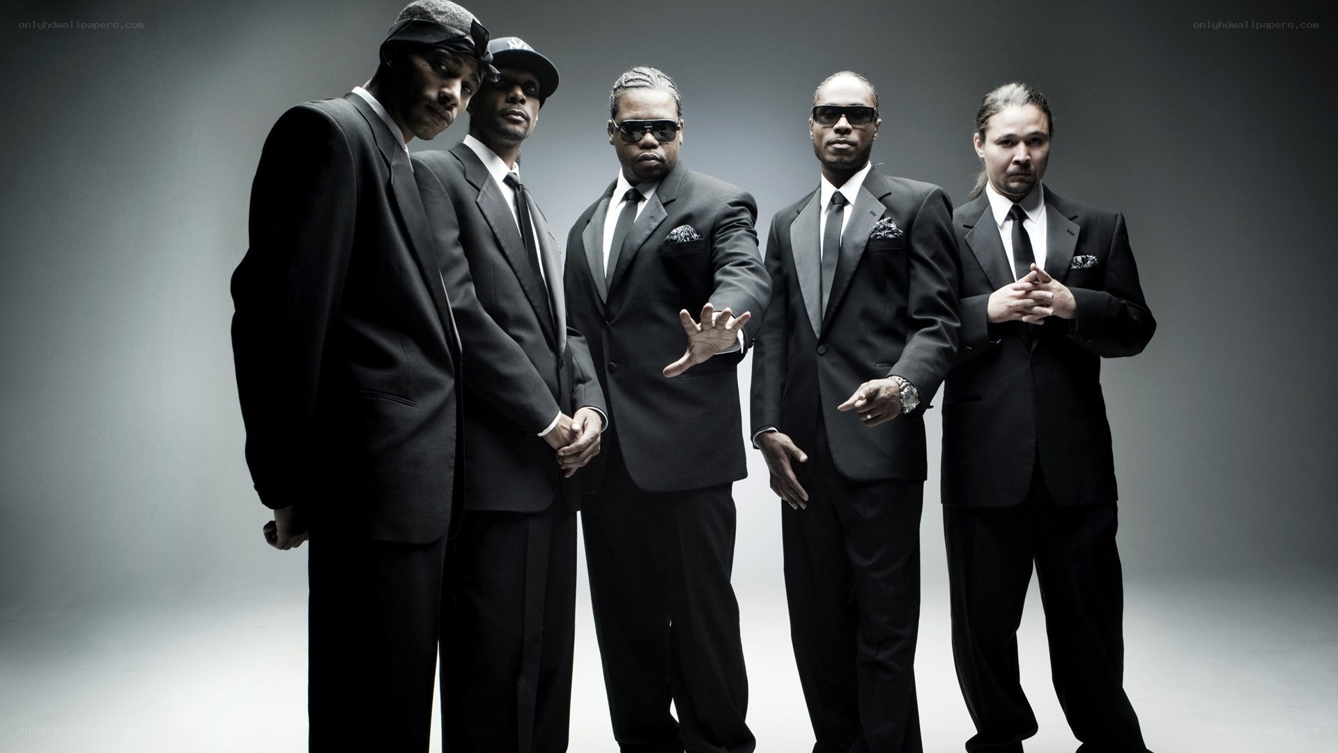 five men in black suits