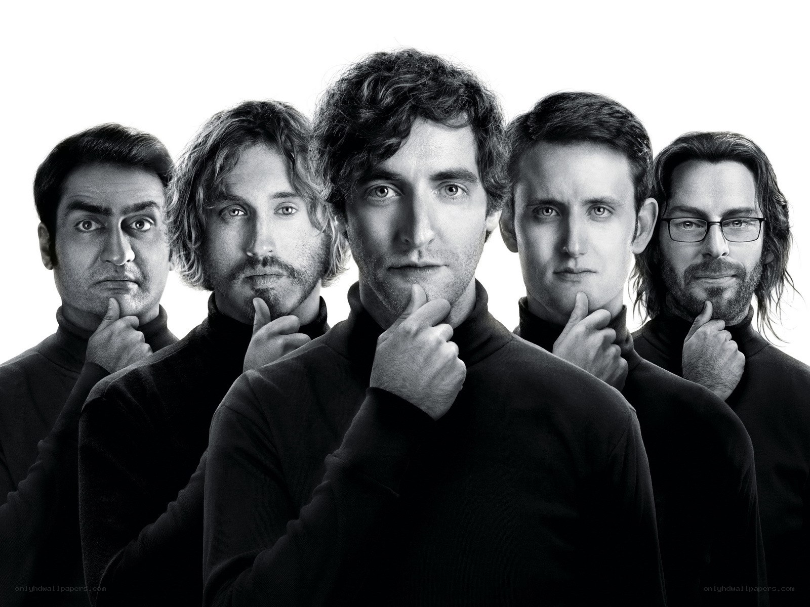 Five men in black turtlenecks