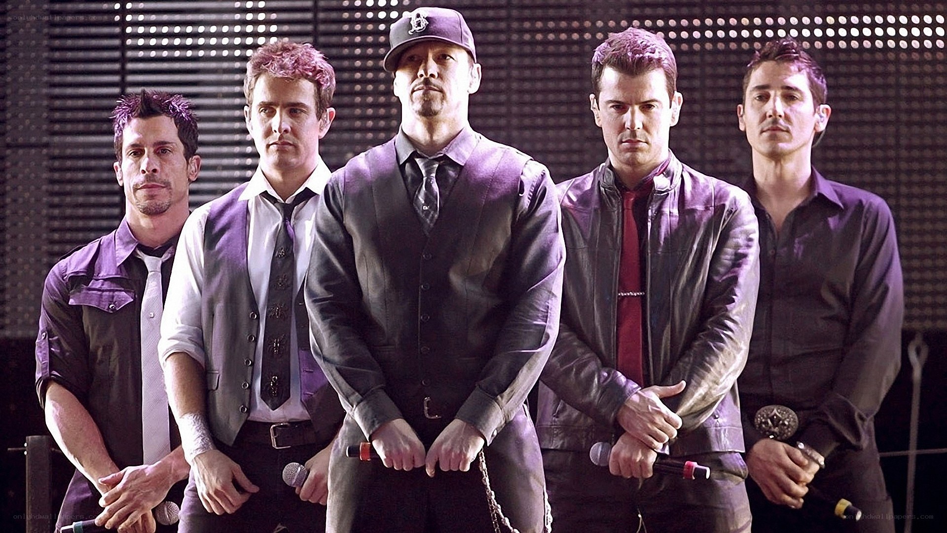 Five men in purple-themed attire