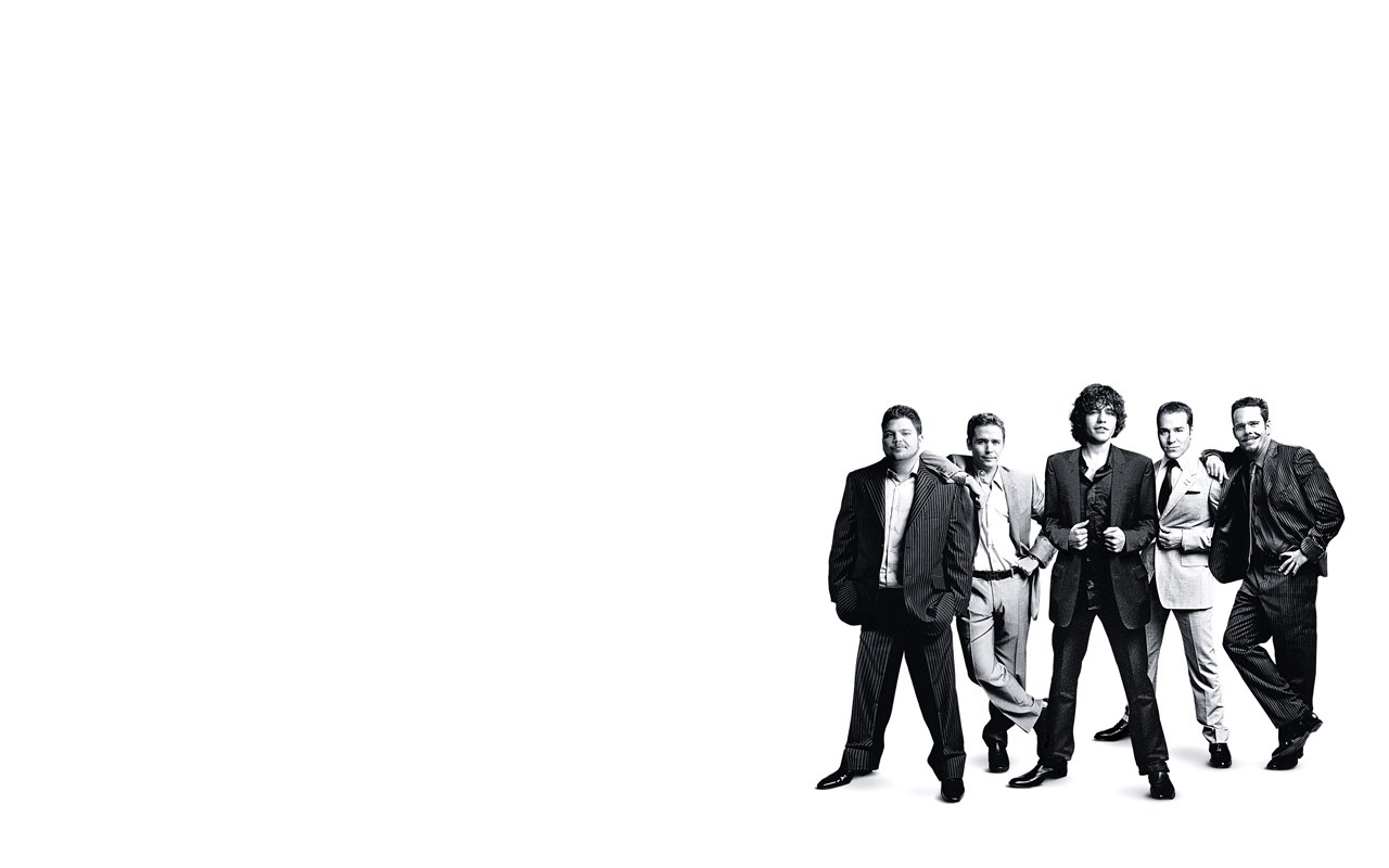 five men in suits posing