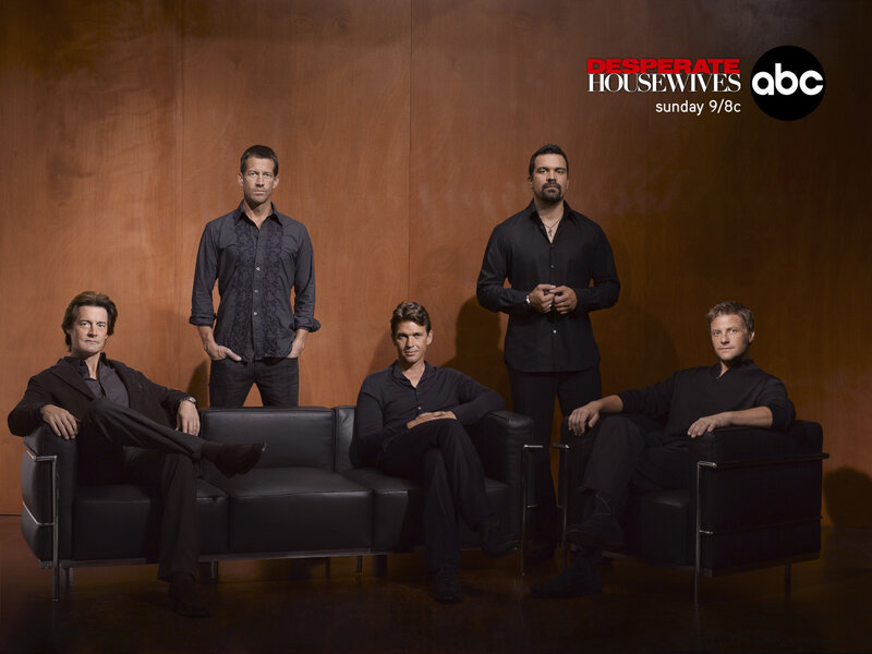 Five Men on Black Couches