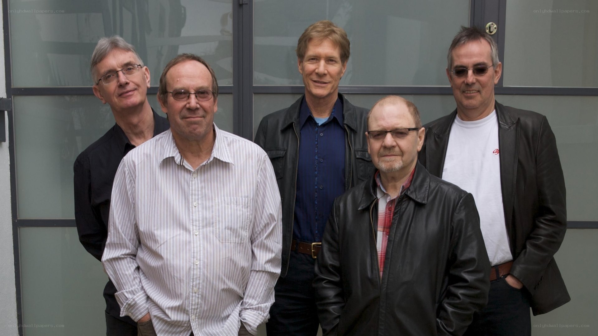 five men posing for a photo