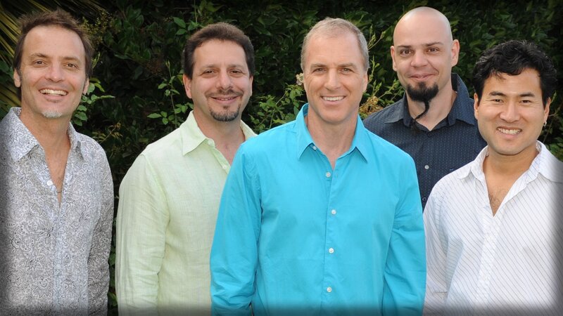 five men posing outdoors