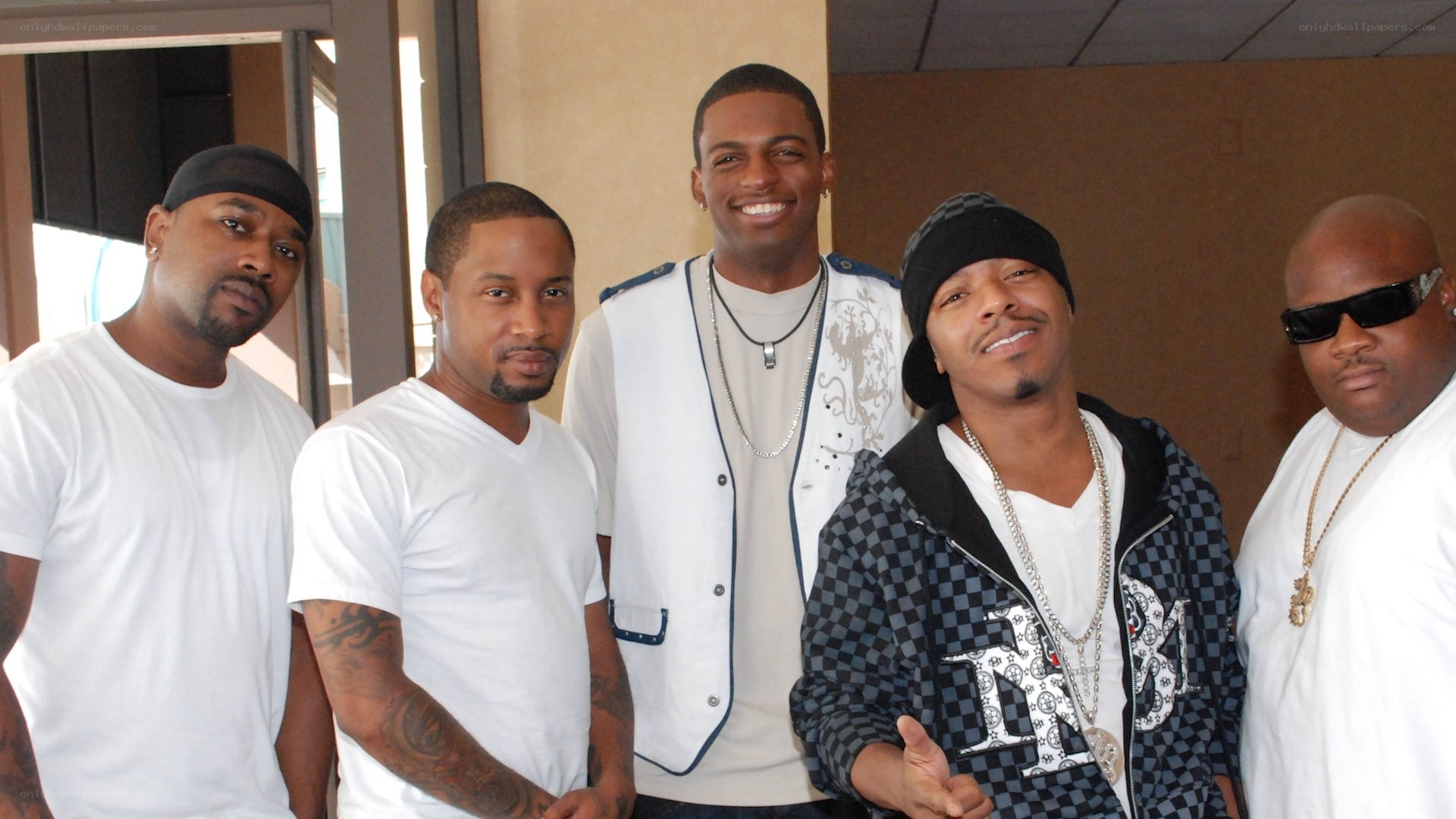five men posing together