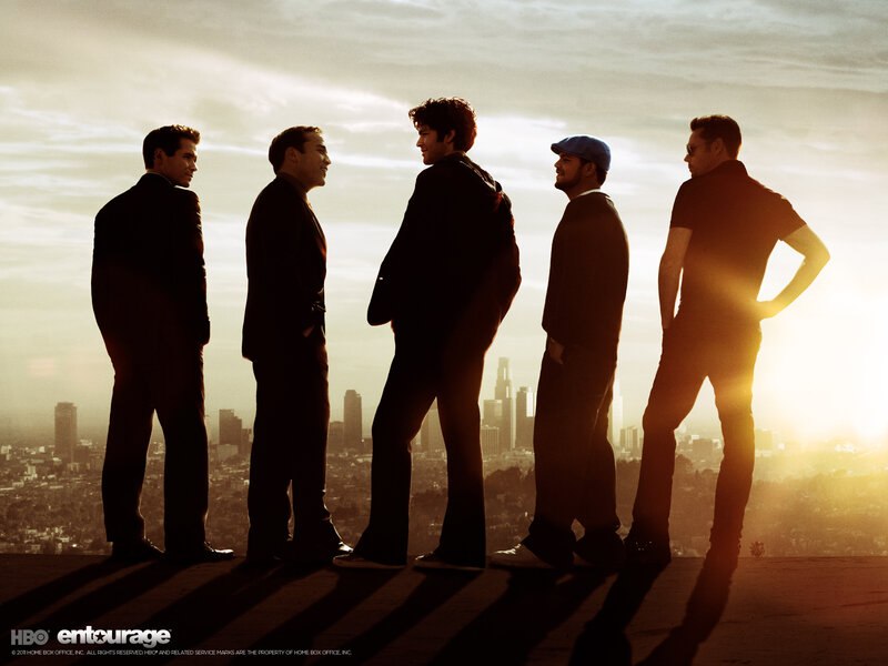 Five men silhouetted against a city skyline