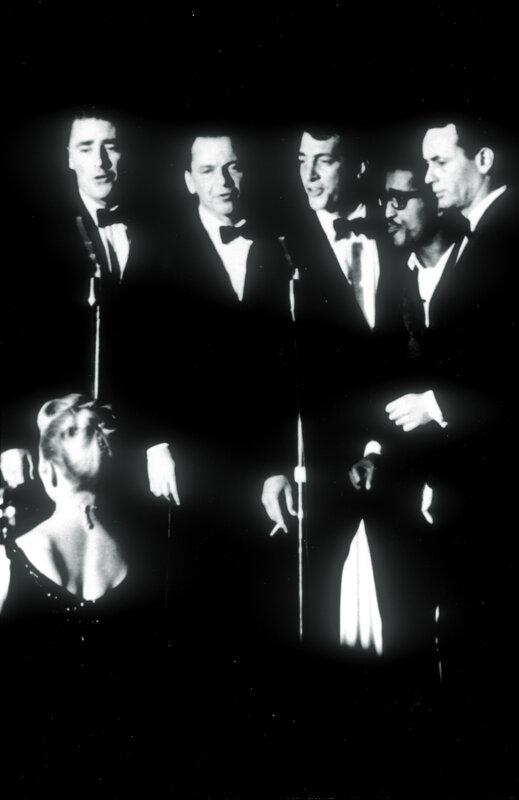 Five men singing on stage