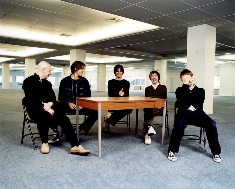 Five Men Sitting at Table