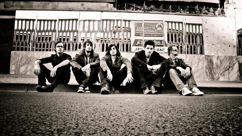 Five Men Sitting on Curb