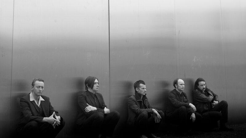 Five Men Sitting on Floor