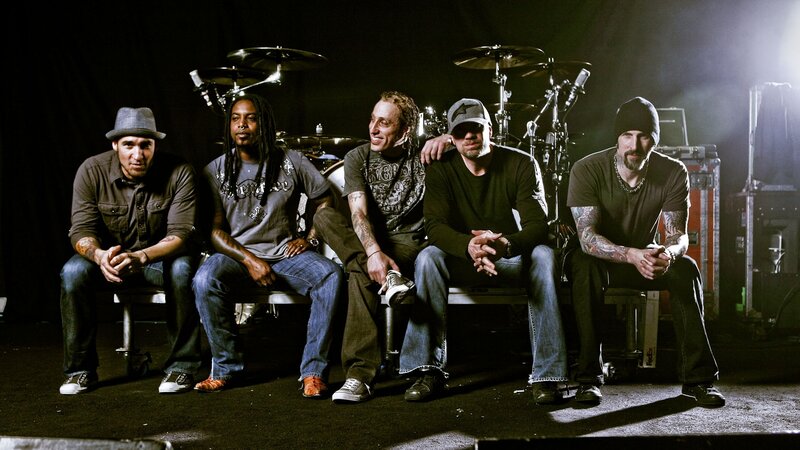 Five Men Sitting on Stage