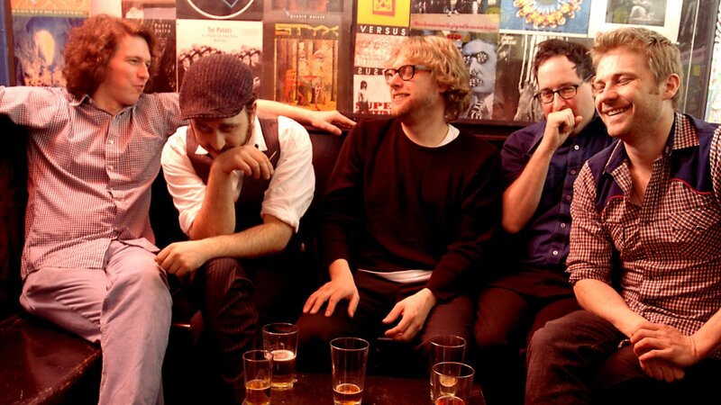 Five Men Sitting Together