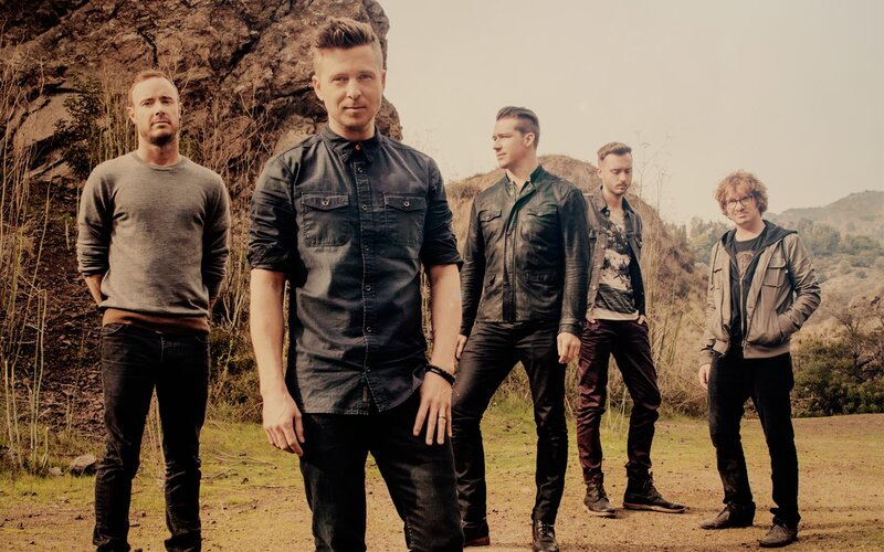 Five Men Standing Outdoors