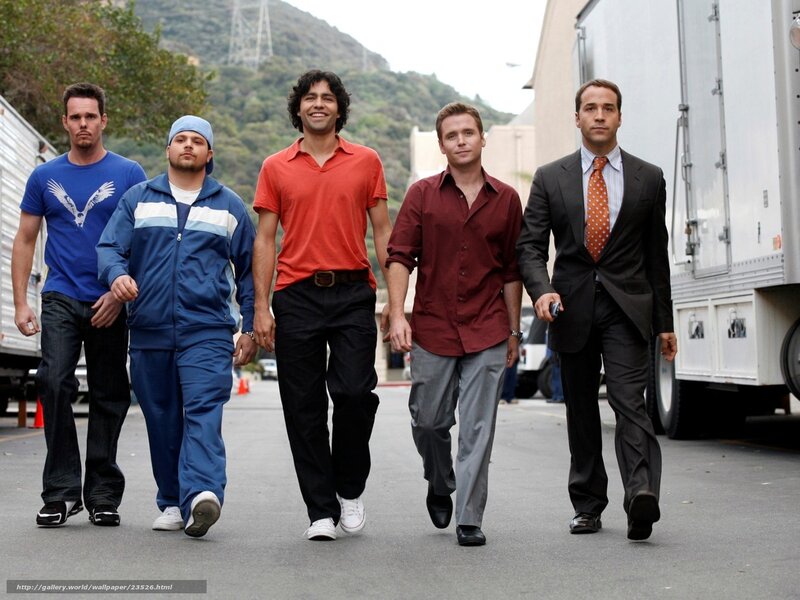 five men walking on set