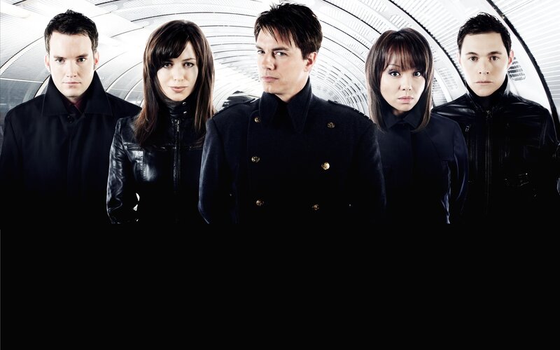 five people in black coats