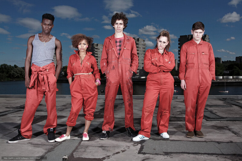 Five people in red overalls