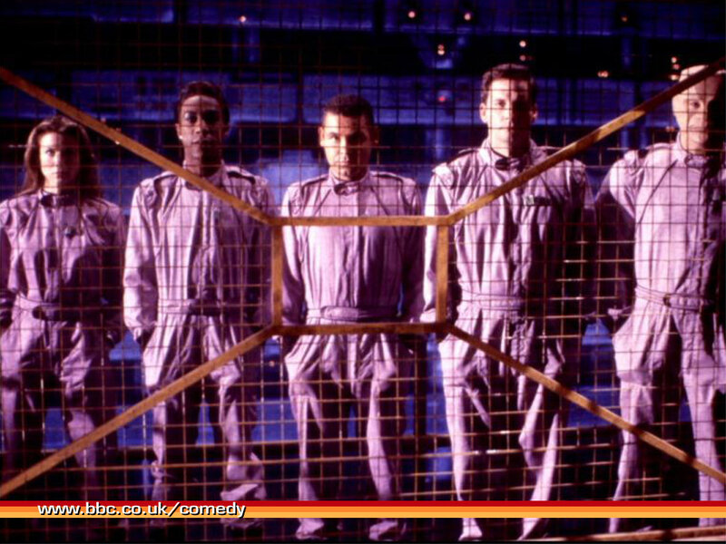 five people in uniform behind mesh