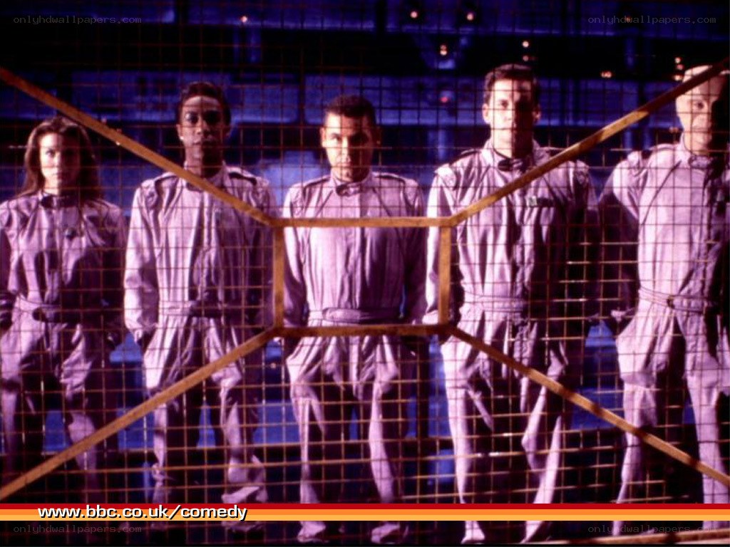five people in uniform behind mesh