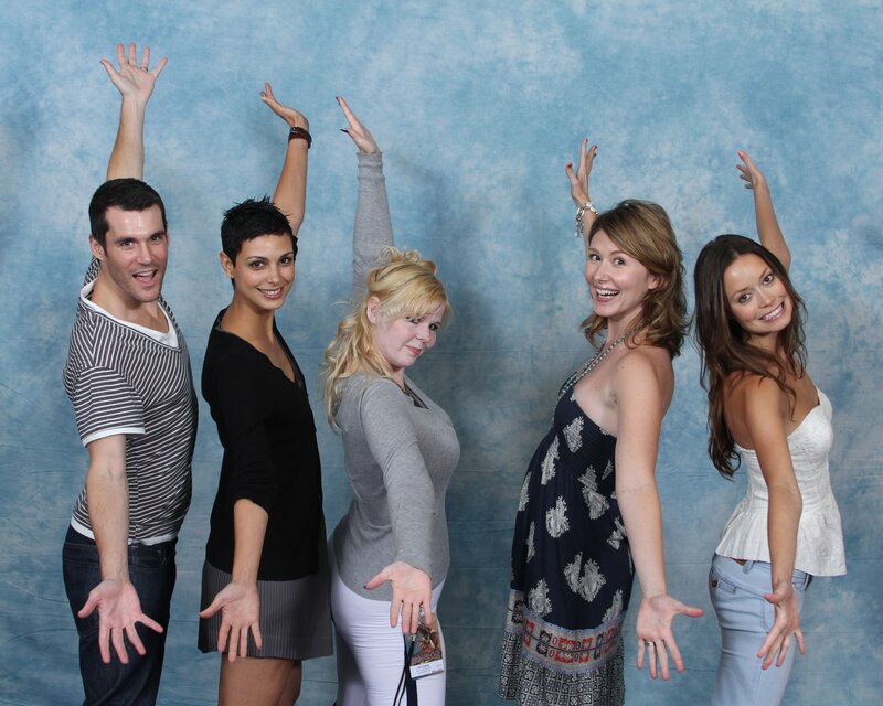 five people posing together