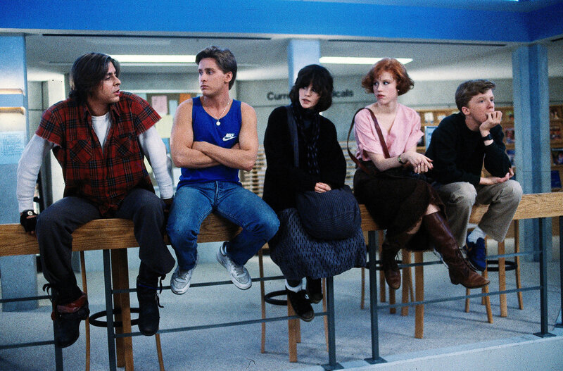 Five people sitting in a library