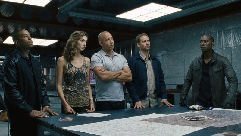 Five People Standing — Black, Serious, Photograph, Table