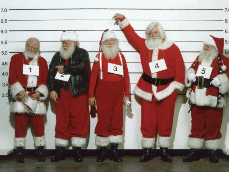 Five Santas in a lineup