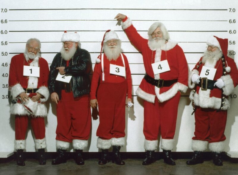 Five Santas in a lineup
