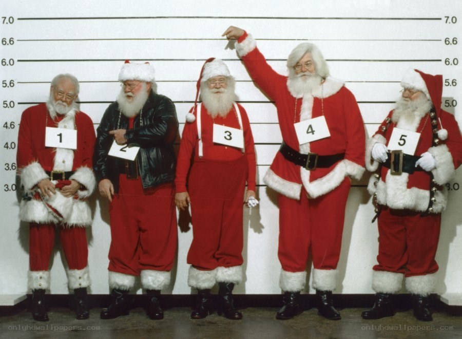 Five Santas in a lineup