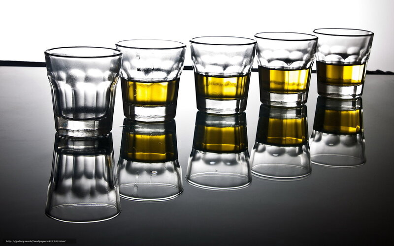 Five shot glasses with liquid