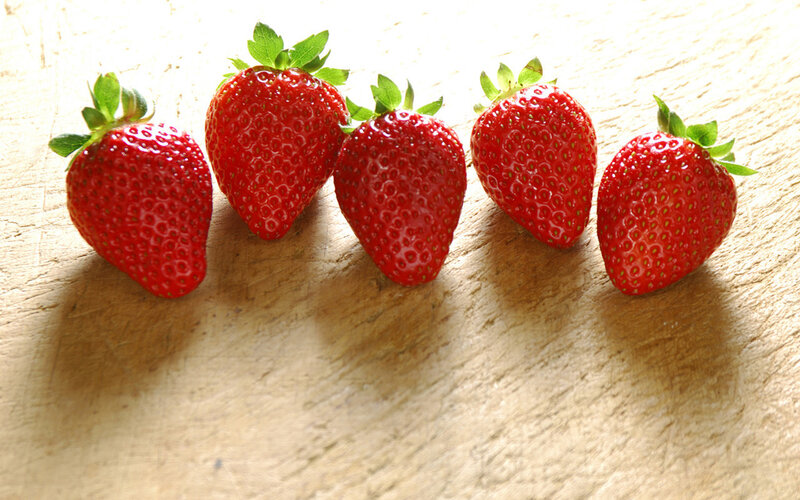Five Strawberries on Wood